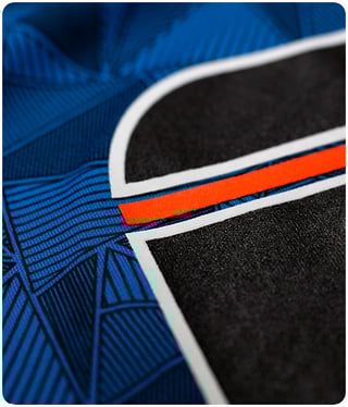 Outlines help decoration stand out on digital patterned shirts.
