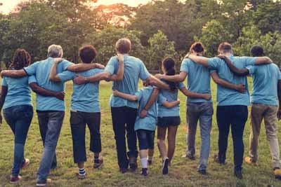 Family reunion goers wearing matching t-shirts