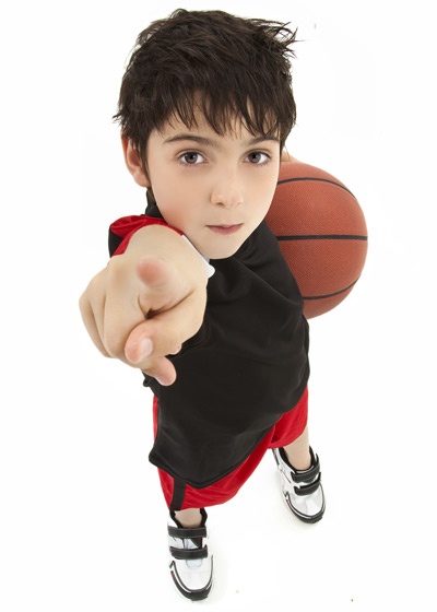 young boy holding basketball